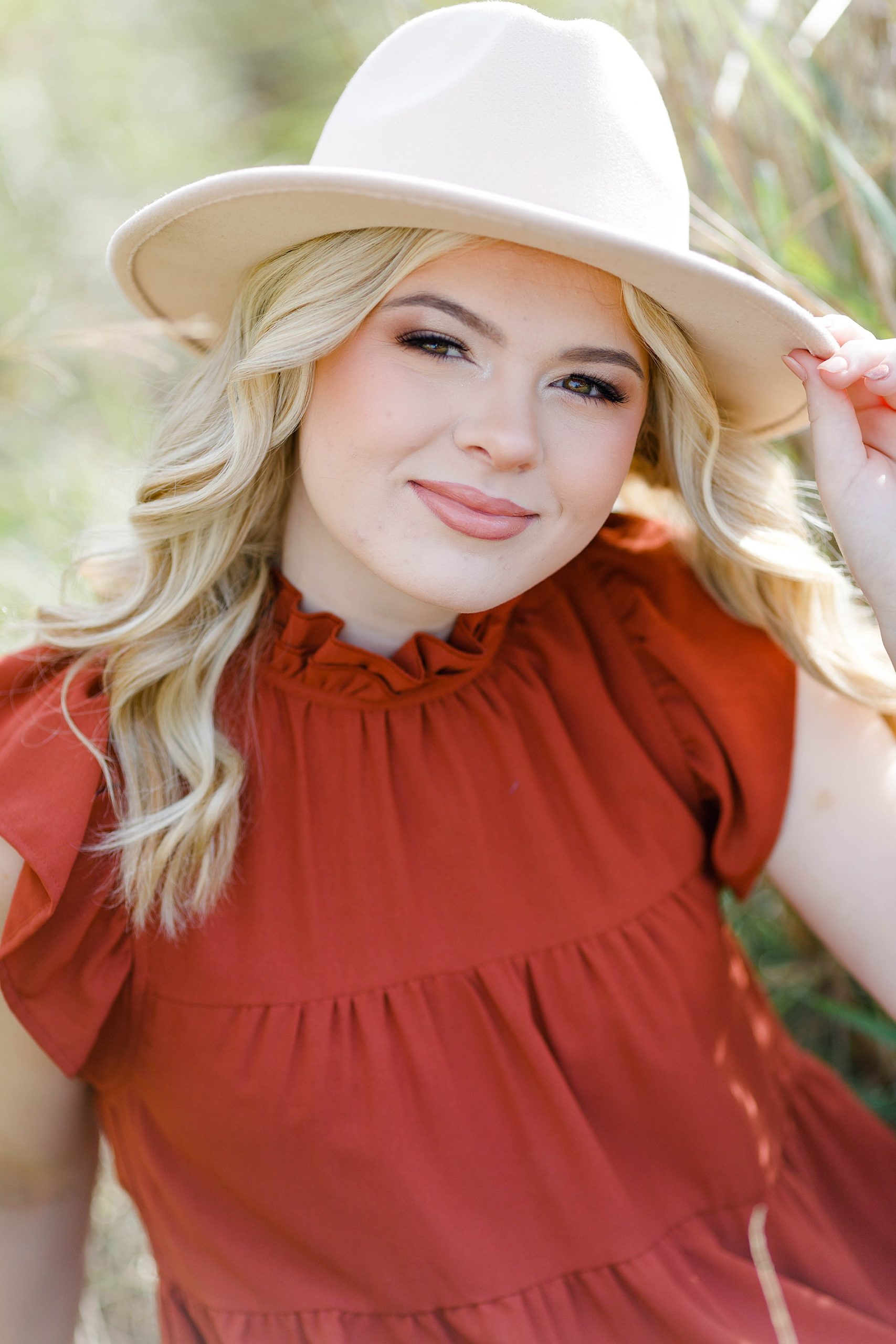 Senior portraits with accessories by Southern Louisiana Senior Photographer Kathryn and Travis