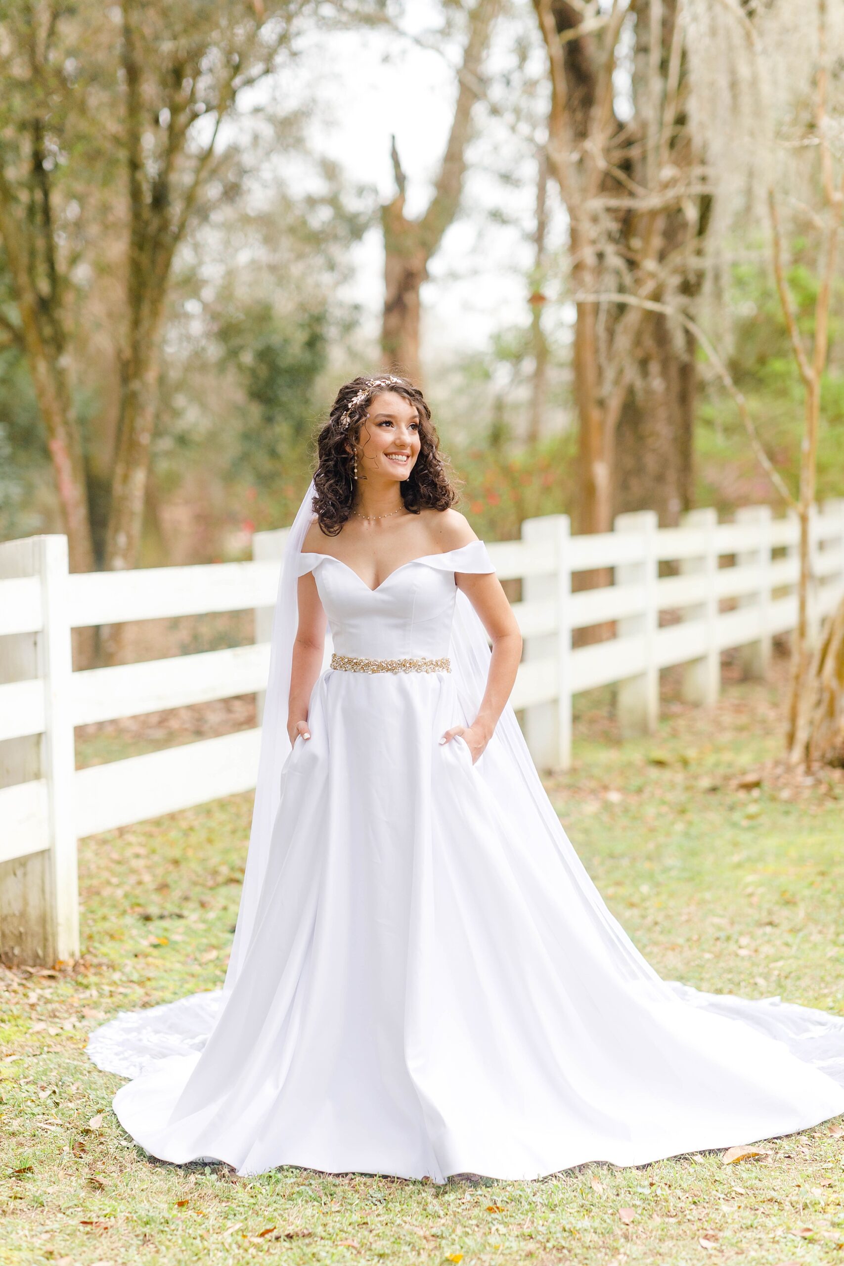 bridal portraits by white fence