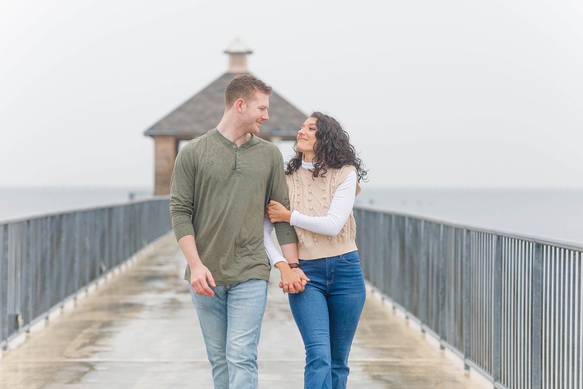 couple walk together during engagement session