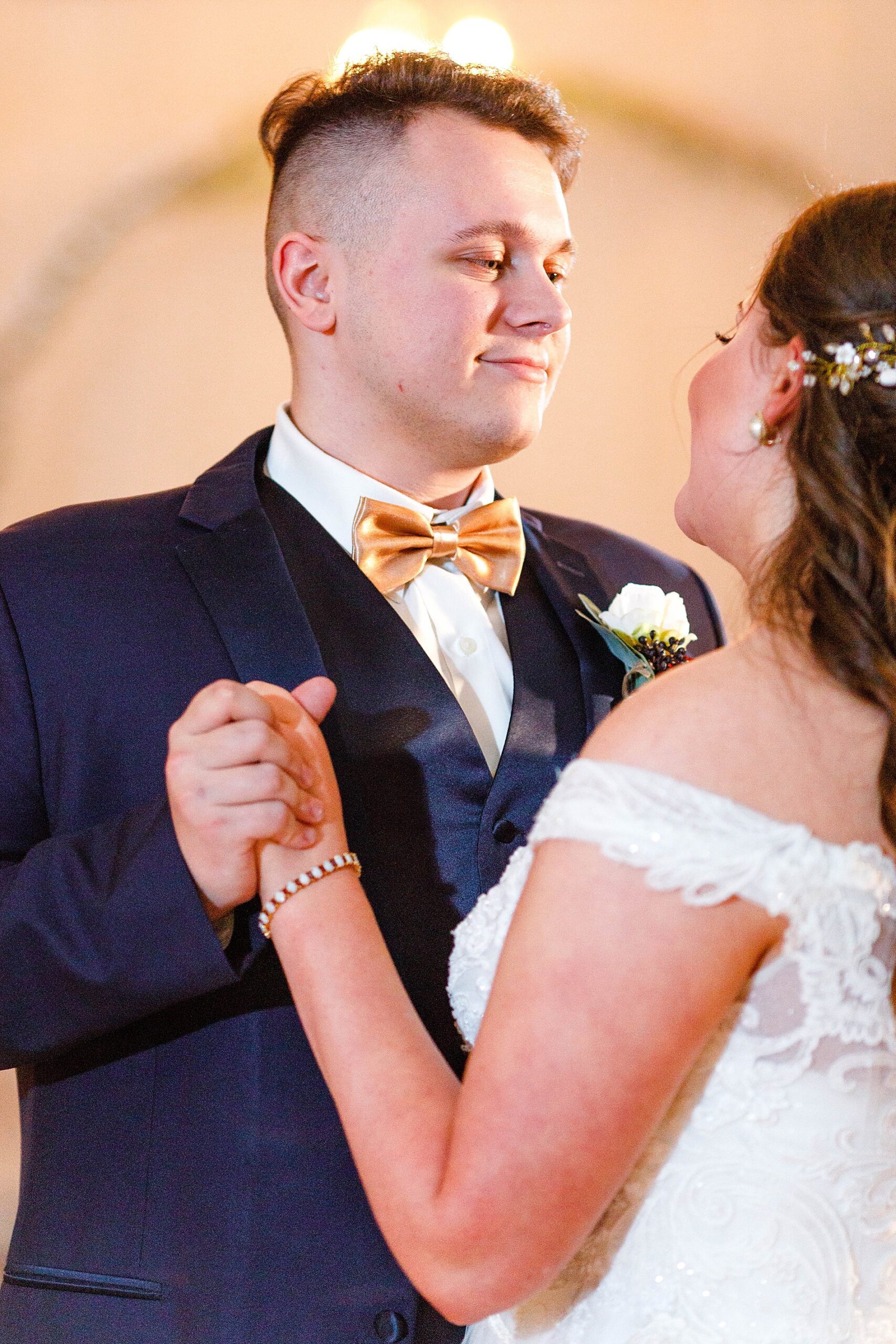 bride and groom share first dance together as husband and wife